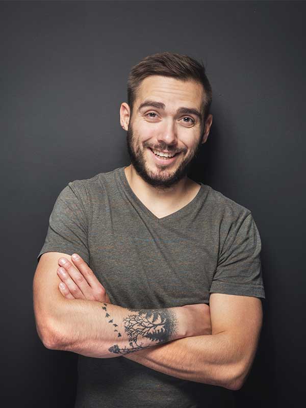 joyful-handsome-man-on-a-black-background-P5YU2XE.jpg